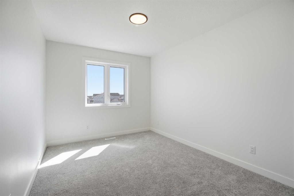201 Bridgeport Gate, Chestermere, AB - Indoor Photo Showing Other Room