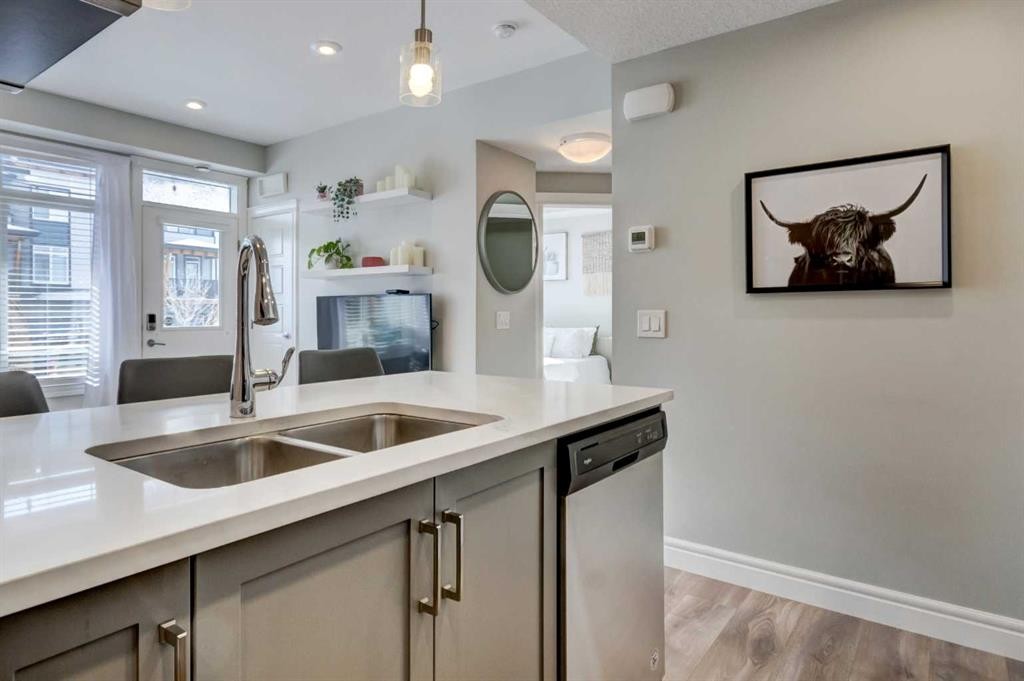 15-230 Seton Passage, Calgary, AB - Indoor Photo Showing Kitchen With Double Sink