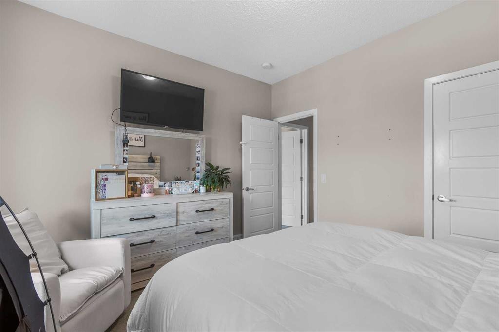 811-250 Fireside View, Cochrane, AB - Indoor Photo Showing Bedroom