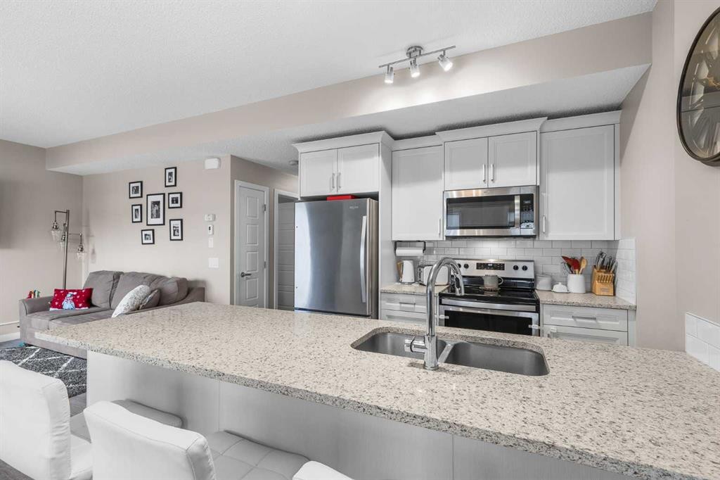 811-250 Fireside View, Cochrane, AB - Indoor Photo Showing Kitchen With Stainless Steel Kitchen With Double Sink With Upgraded Kitchen