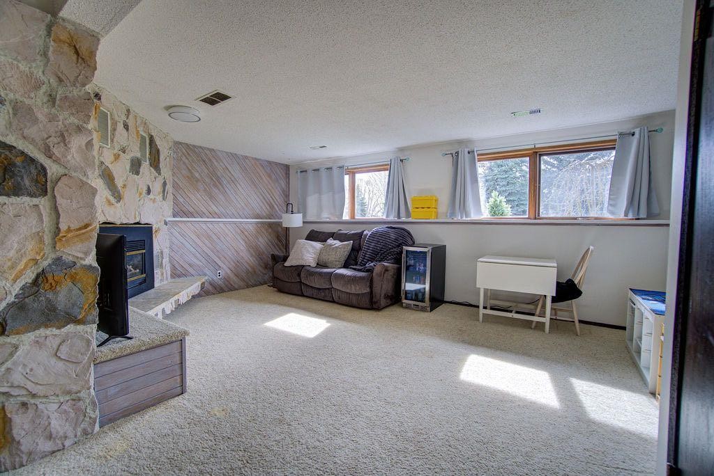 47 Willow Road, Claresholm, AB - Indoor Photo Showing Living Room With Fireplace