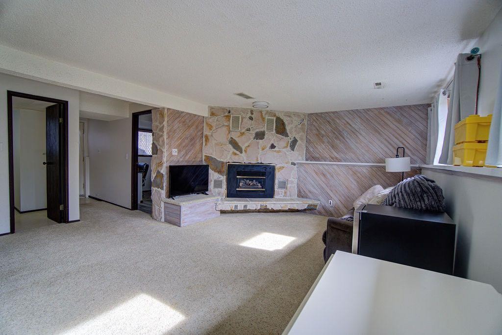 47 Willow Road, Claresholm, AB - Indoor With Fireplace