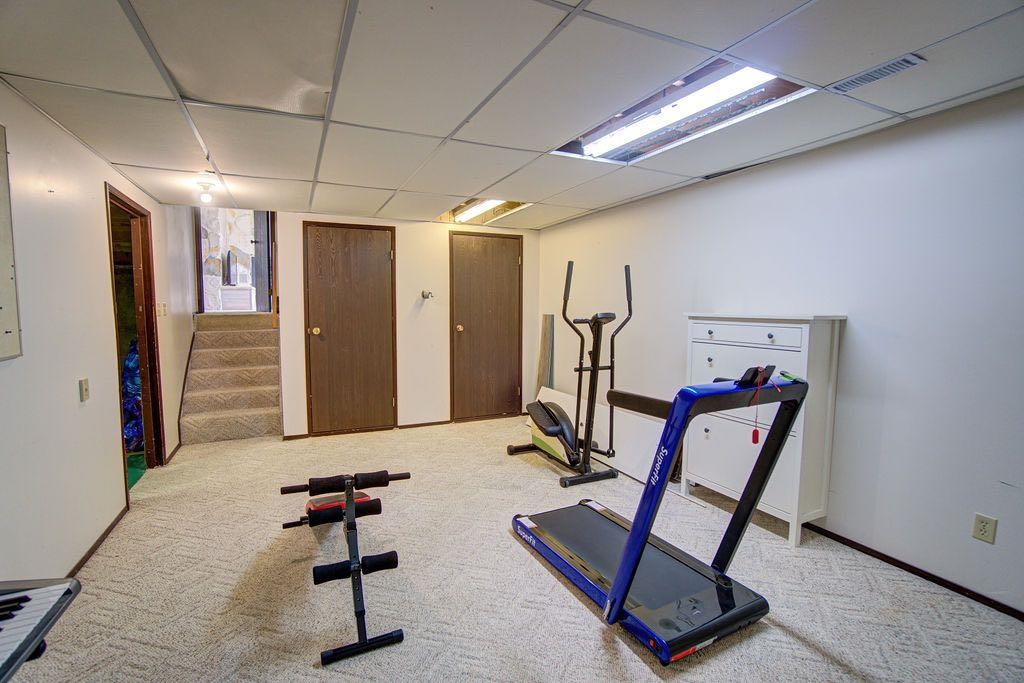 47 Willow Road, Claresholm, AB - Indoor Photo Showing Gym Room