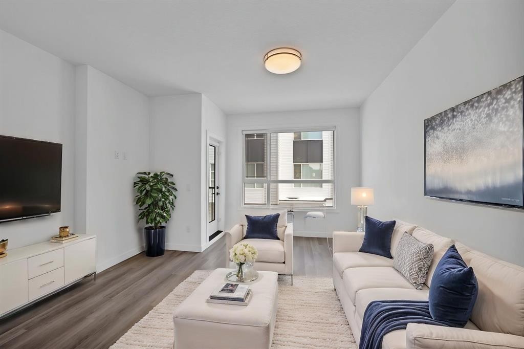 105 Panatella Square Nw, Calgary, AB - Indoor Photo Showing Living Room