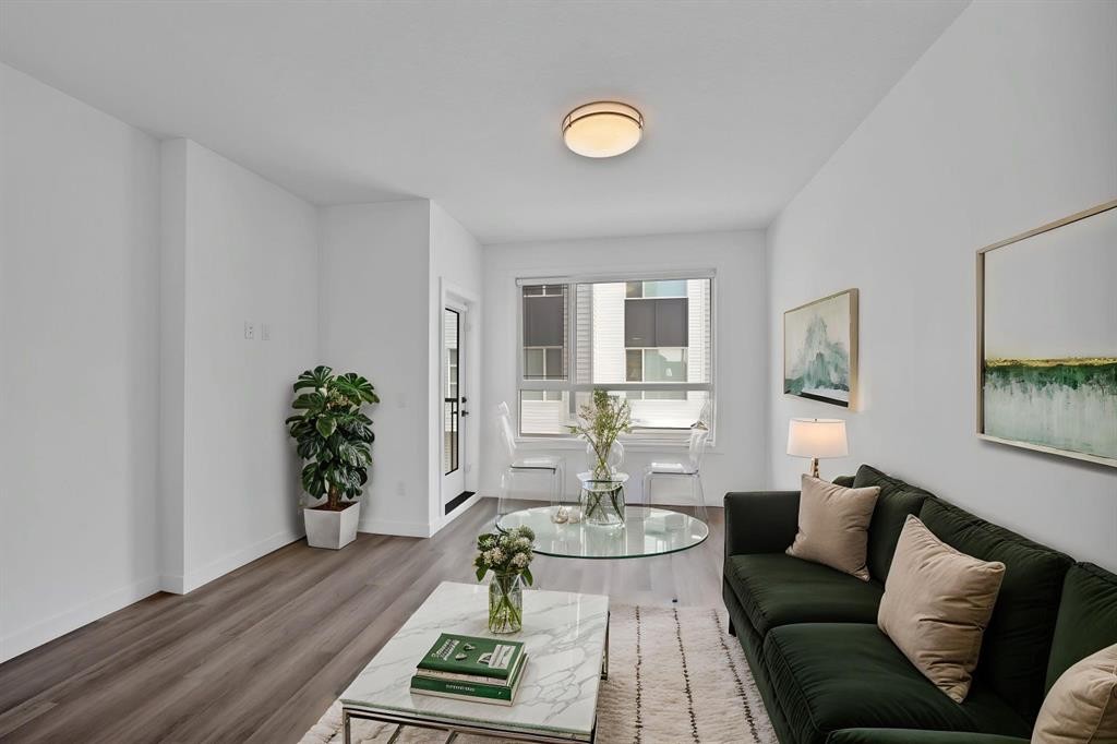 105 Panatella Square Nw, Calgary, AB - Indoor Photo Showing Living Room