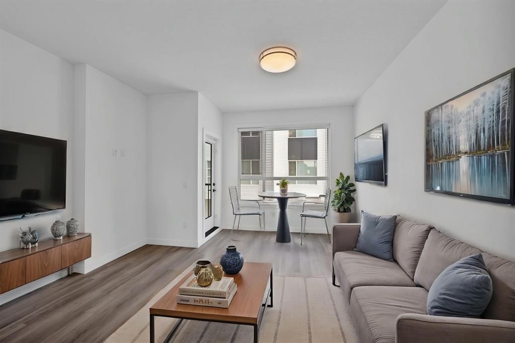 105 Panatella Square Nw, Calgary, AB - Indoor Photo Showing Living Room