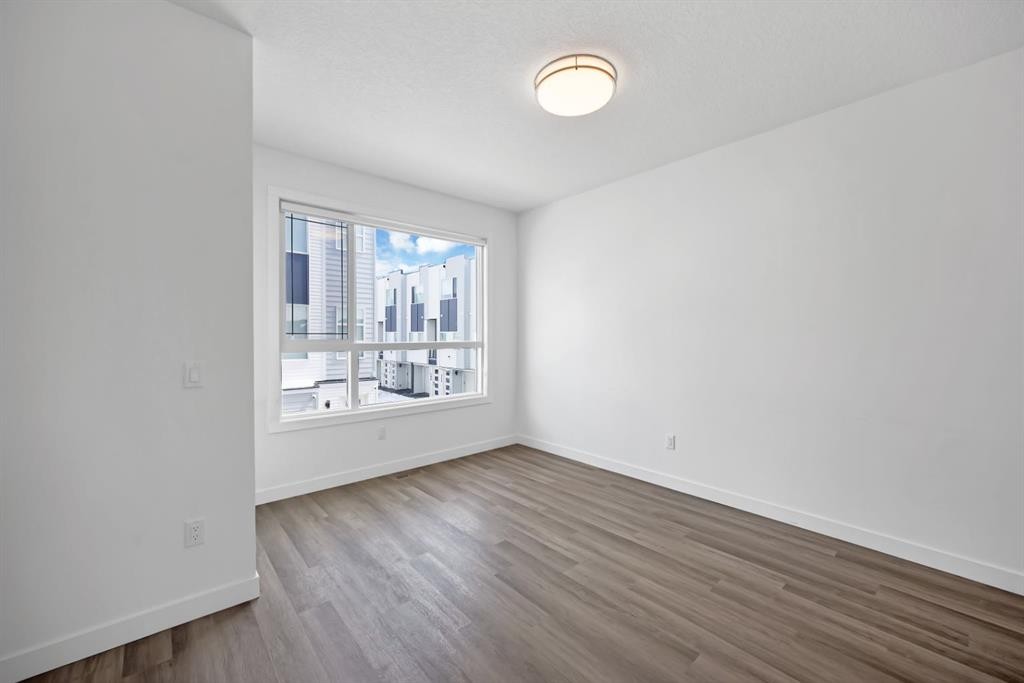 105 Panatella Square Nw, Calgary, AB - Indoor Photo Showing Other Room