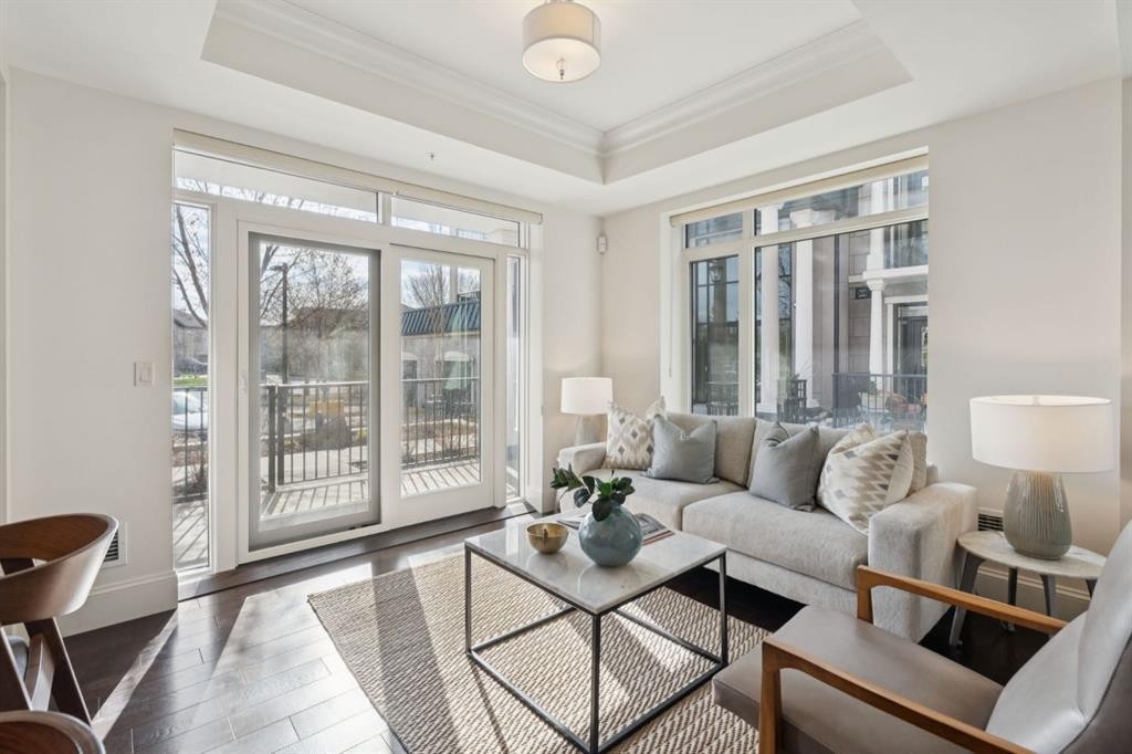 103-211 Quarry Way Se, Calgary, AB - Indoor Photo Showing Living Room