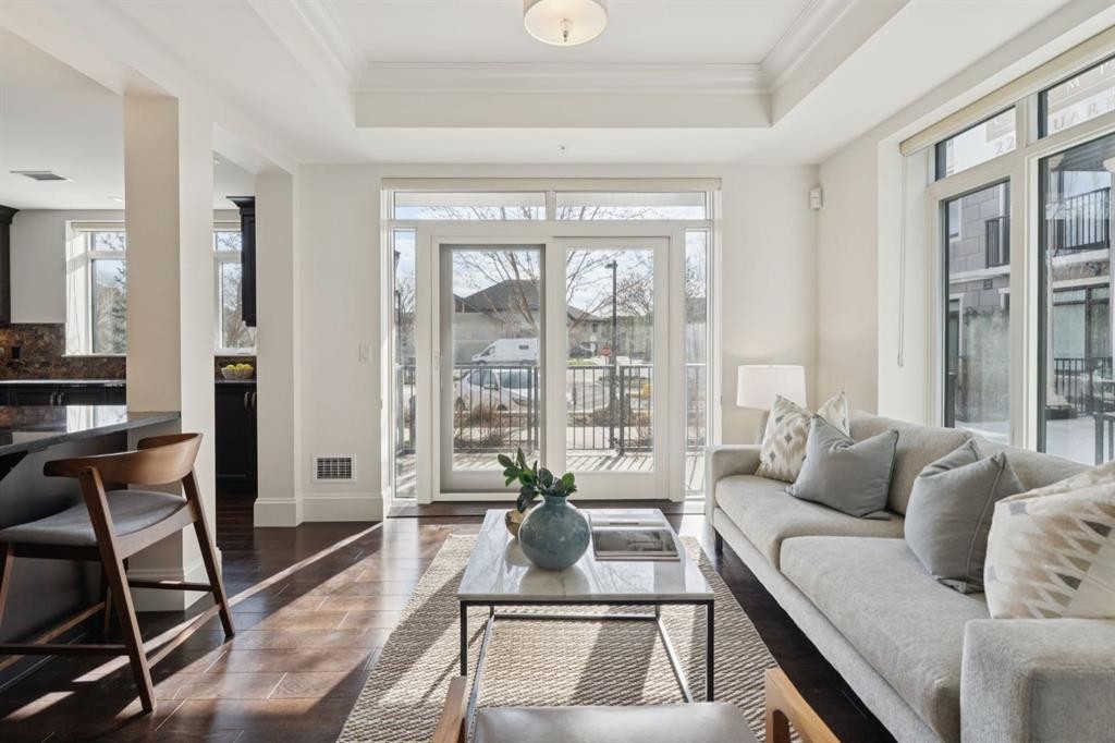 103-211 Quarry Way Se, Calgary, AB - Indoor Photo Showing Living Room