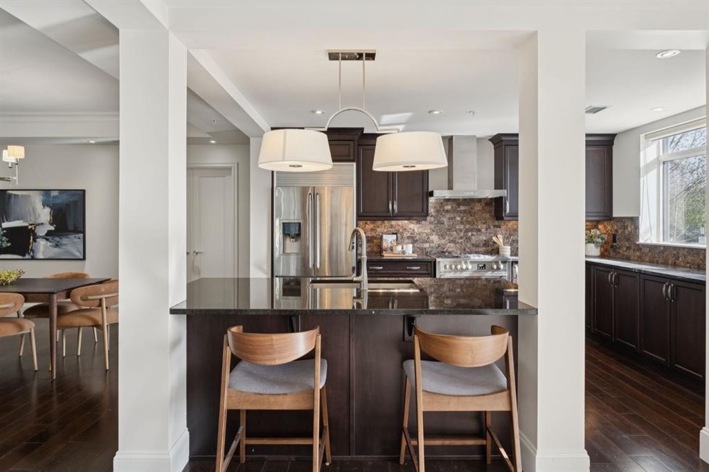 103-211 Quarry Way Se, Calgary, AB - Indoor Photo Showing Kitchen With Upgraded Kitchen