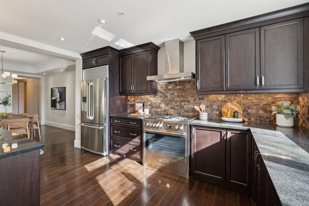 103-211 Quarry Way Se, Calgary, AB - Indoor Photo Showing Kitchen With Stainless Steel Kitchen With Upgraded Kitchen