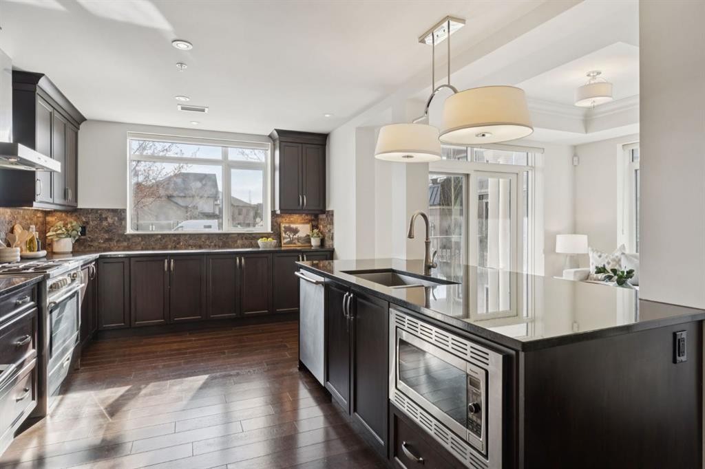 103-211 Quarry Way Se, Calgary, AB - Indoor Photo Showing Kitchen With Upgraded Kitchen