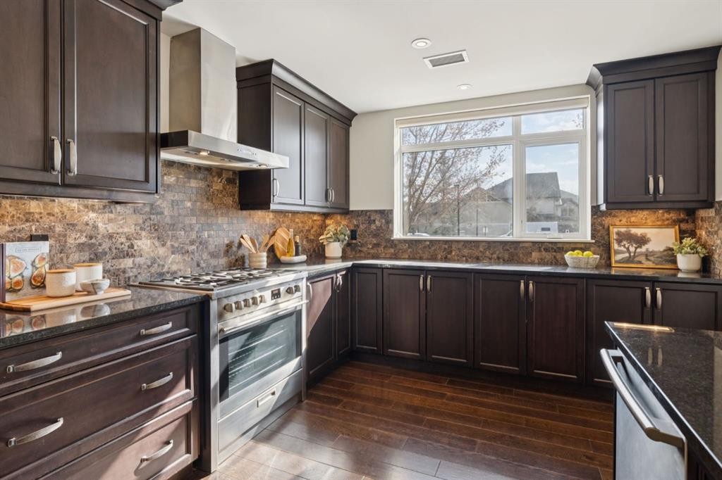 103-211 Quarry Way Se, Calgary, AB - Indoor Photo Showing Kitchen With Upgraded Kitchen