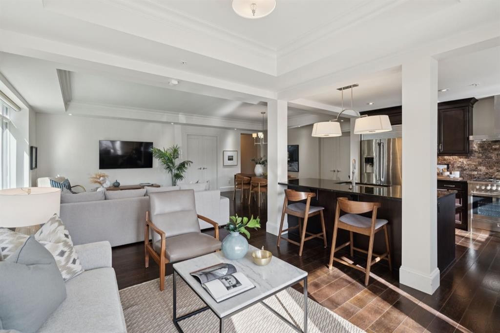 103-211 Quarry Way Se, Calgary, AB - Indoor Photo Showing Living Room