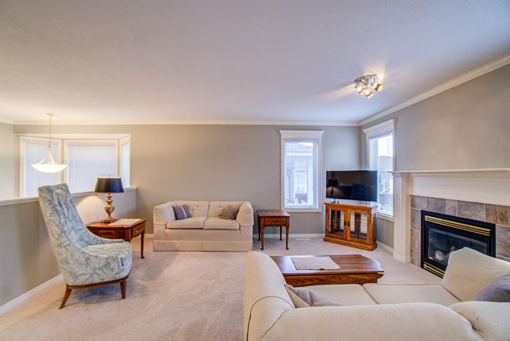 26 Skyline Crescent, Claresholm, AB - Indoor Photo Showing Living Room With Fireplace