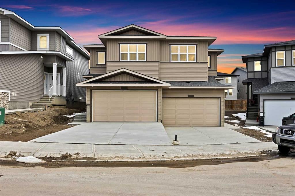 82 Heritage Circle, Cochrane, AB - Outdoor With Facade