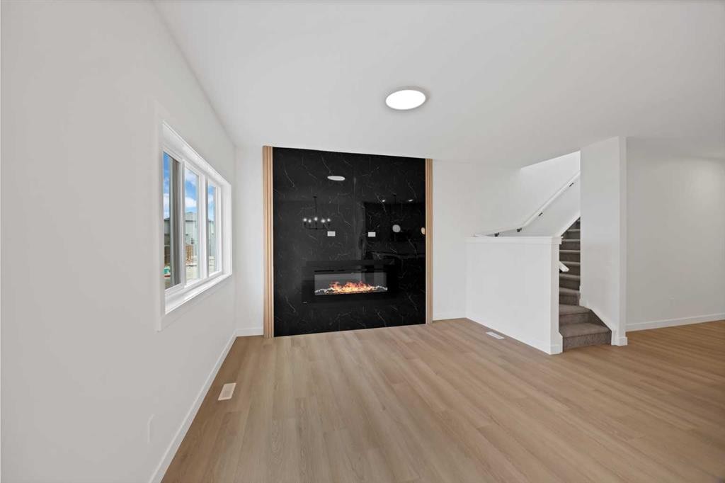 82 Heritage Circle, Cochrane, AB - Indoor With Fireplace