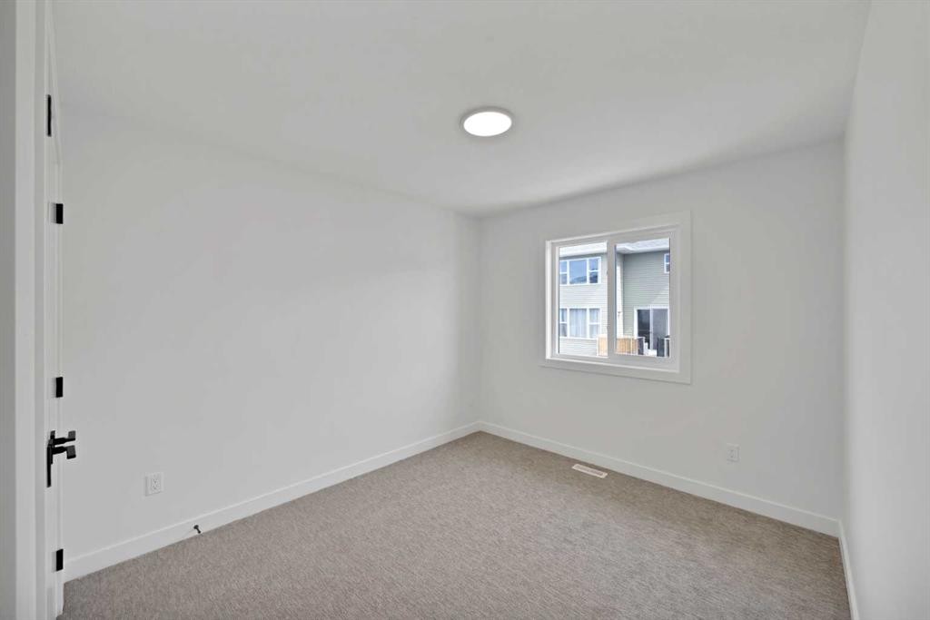 82 Heritage Circle, Cochrane, AB - Indoor Photo Showing Other Room
