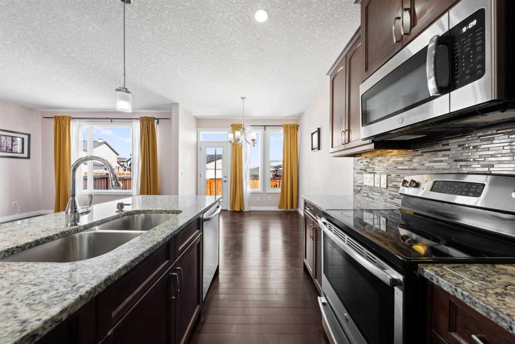 529 Saddlelake Drive Ne, Calgary, AB - Indoor Photo Showing Kitchen With Double Sink With Upgraded Kitchen