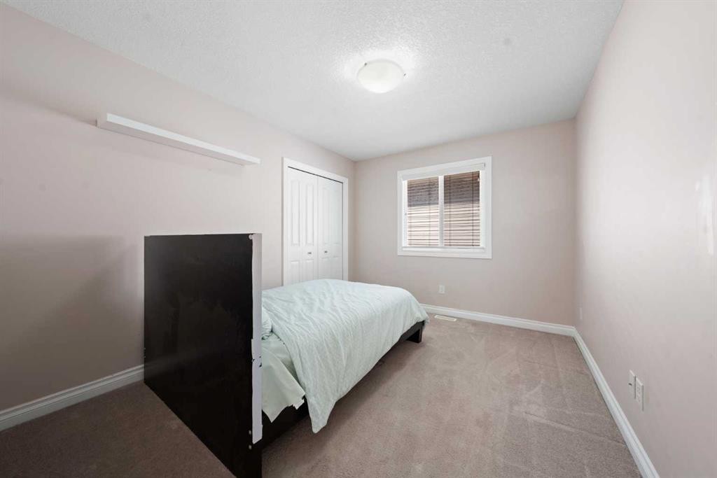 529 Saddlelake Drive Ne, Calgary, AB - Indoor Photo Showing Bedroom