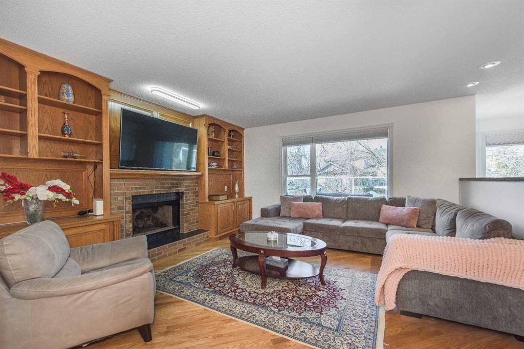 179 Scanlon Green Nw, Calgary, AB - Indoor Photo Showing Living Room With Fireplace