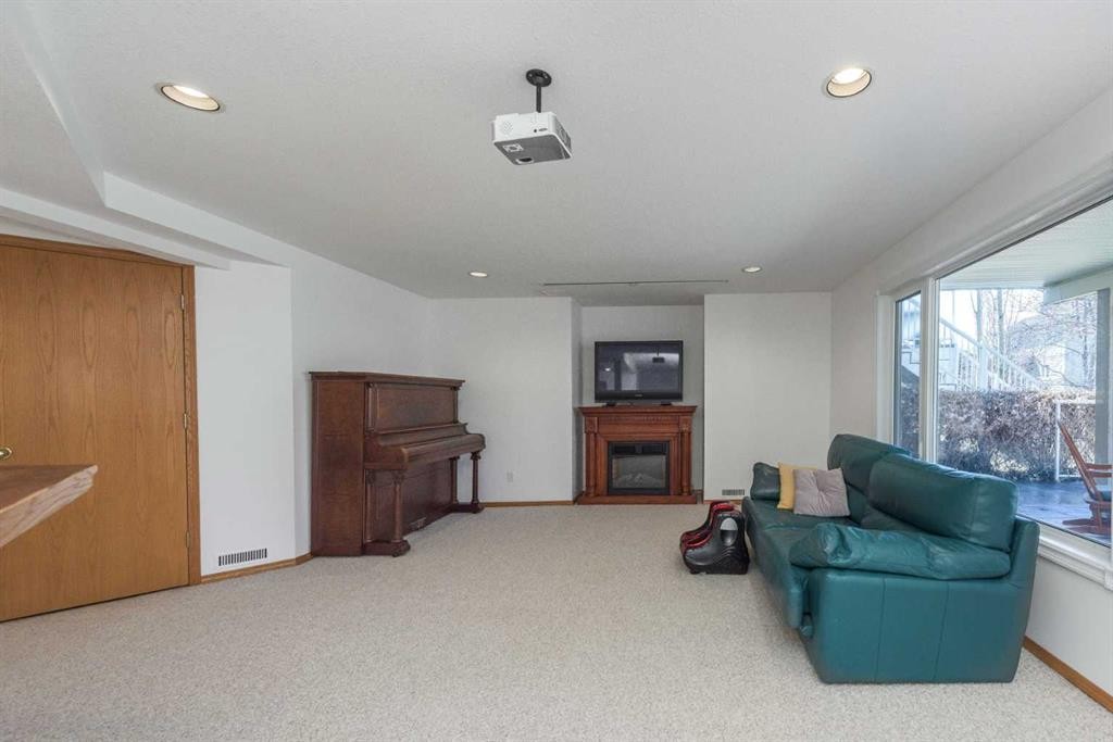 179 Scanlon Green Nw, Calgary, AB - Indoor With Fireplace