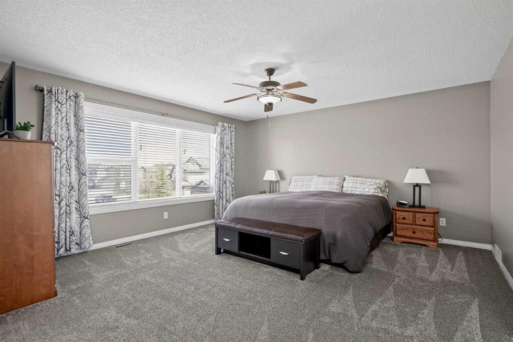 385 Rainbow Falls Way, Chestermere, AB - Indoor Photo Showing Bedroom