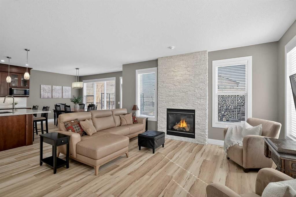 385 Rainbow Falls Way, Chestermere, AB - Indoor Photo Showing Living Room With Fireplace