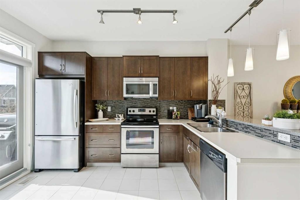 46 Kinlea Common Nw, Calgary, AB - Indoor Photo Showing Kitchen With Stainless Steel Kitchen With Double Sink