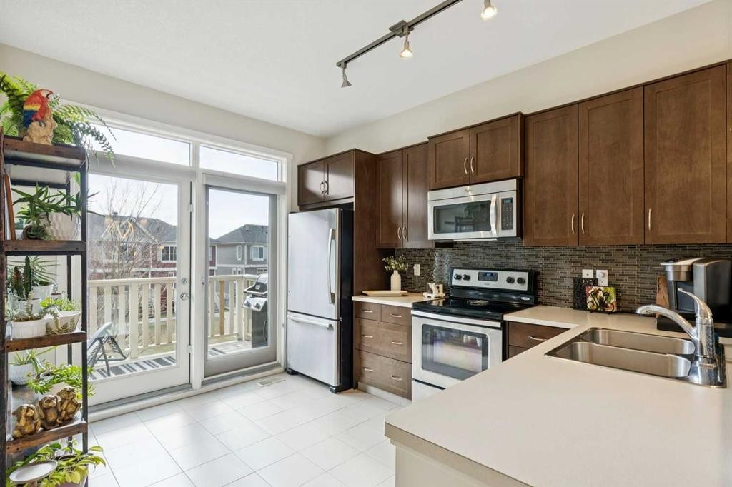 46 Kinlea Common Nw, Calgary, AB - Indoor Photo Showing Kitchen With Stainless Steel Kitchen With Double Sink