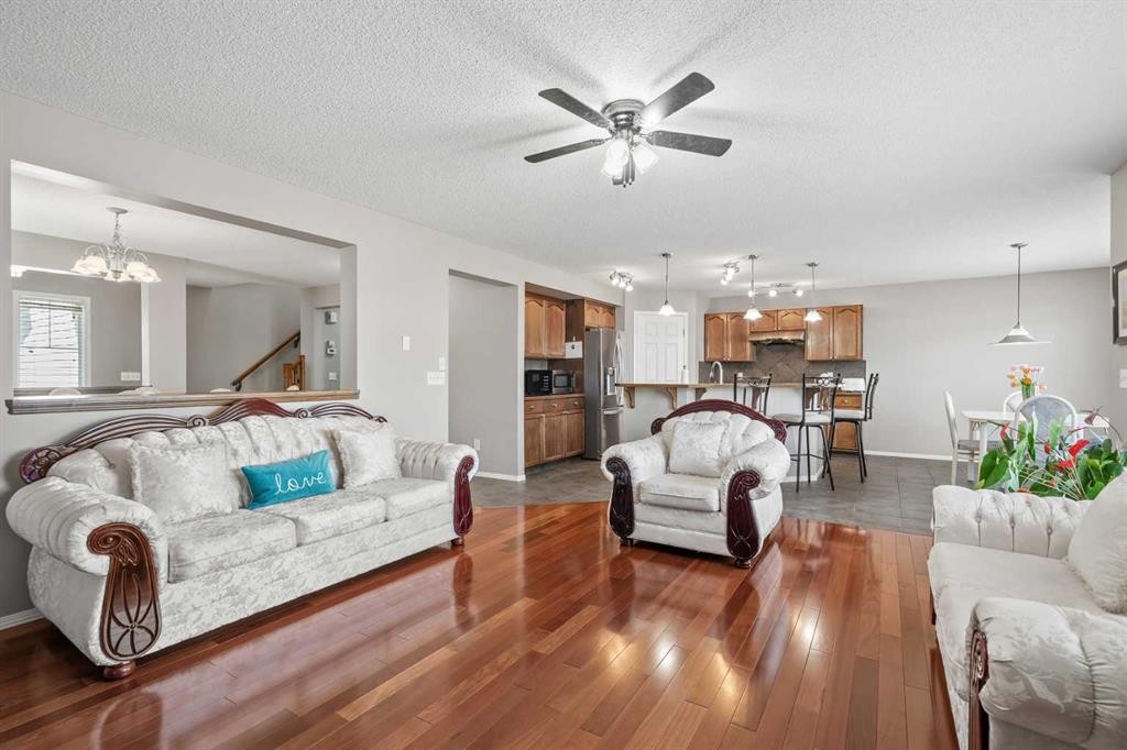 8 Chapalina Rise Se, Calgary, AB - Indoor Photo Showing Living Room