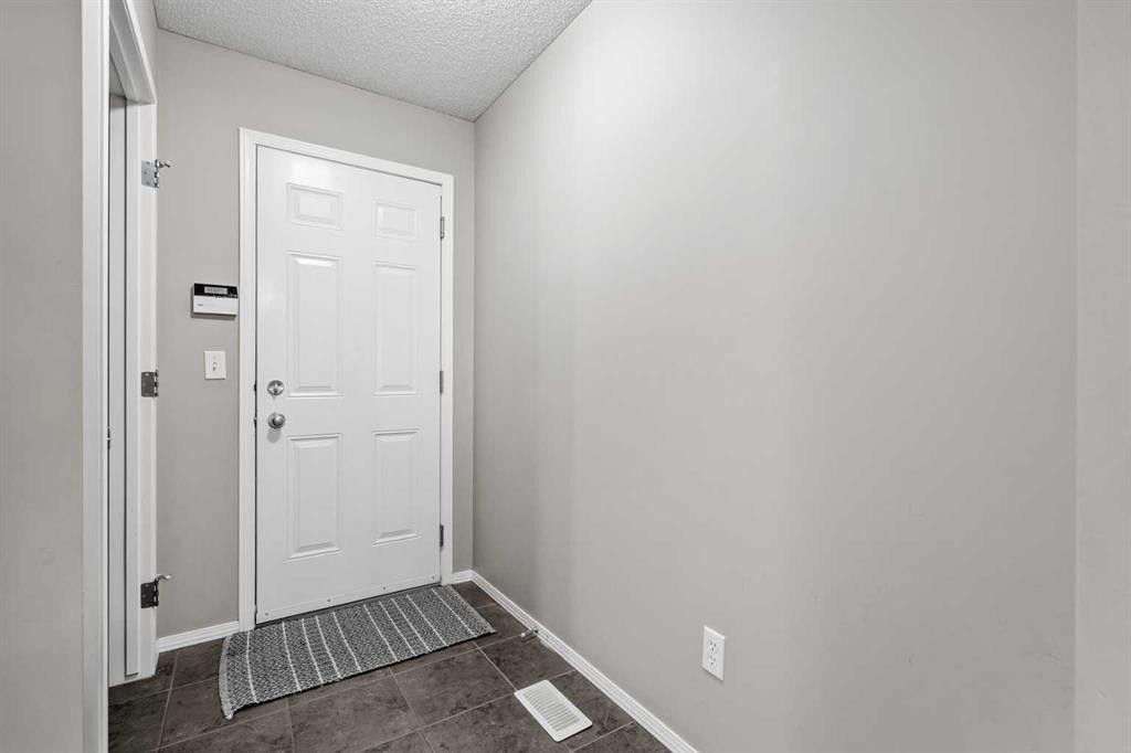 8 Chapalina Rise Se, Calgary, AB - Indoor Photo Showing Other Room