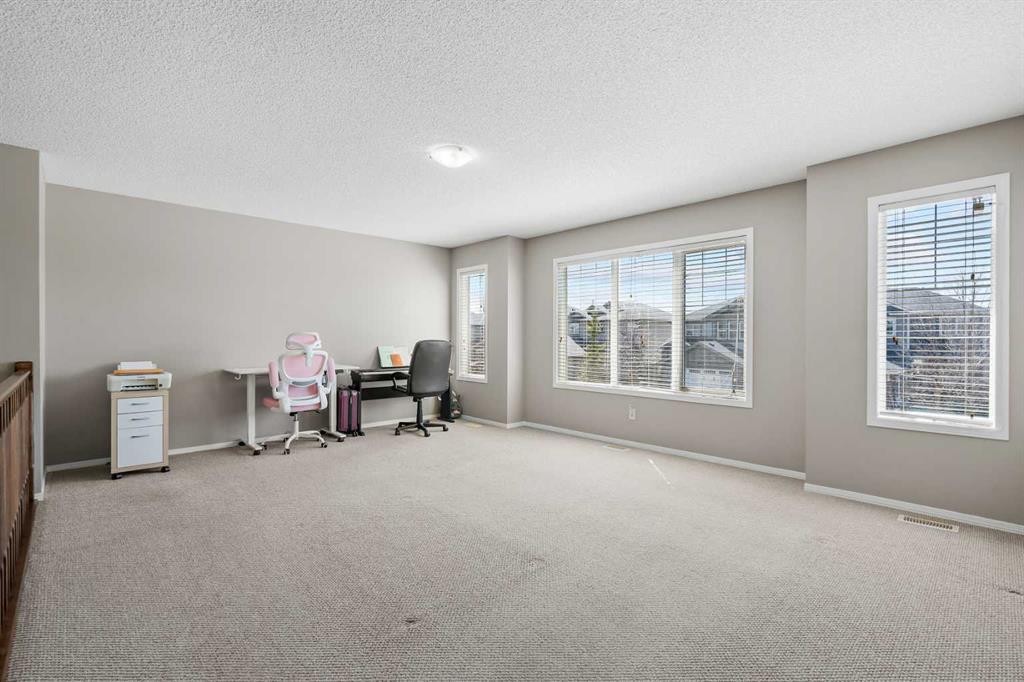 8 Chapalina Rise Se, Calgary, AB - Indoor Photo Showing Other Room