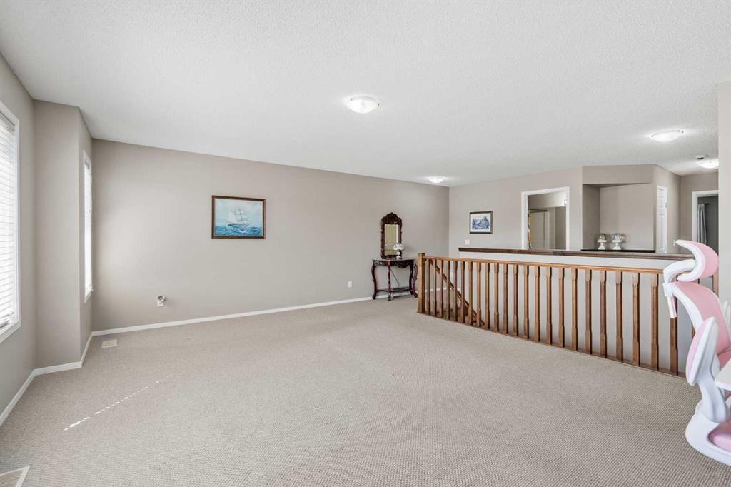 8 Chapalina Rise Se, Calgary, AB - Indoor Photo Showing Other Room