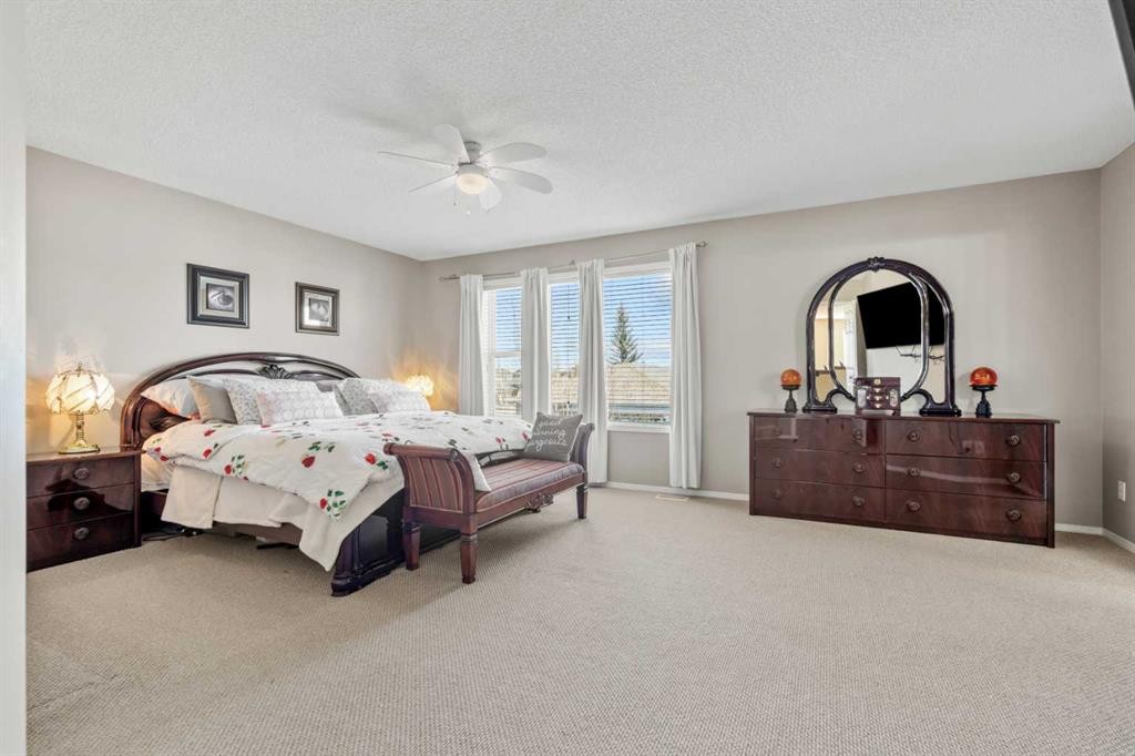 8 Chapalina Rise Se, Calgary, AB - Indoor Photo Showing Bedroom