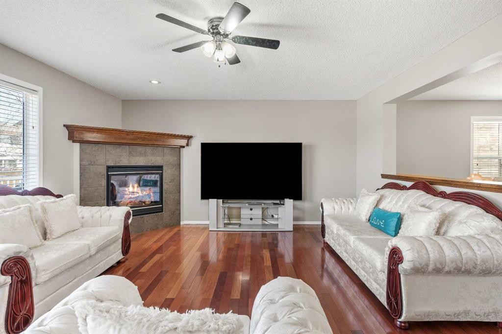 8 Chapalina Rise Se, Calgary, AB - Indoor Photo Showing Living Room With Fireplace