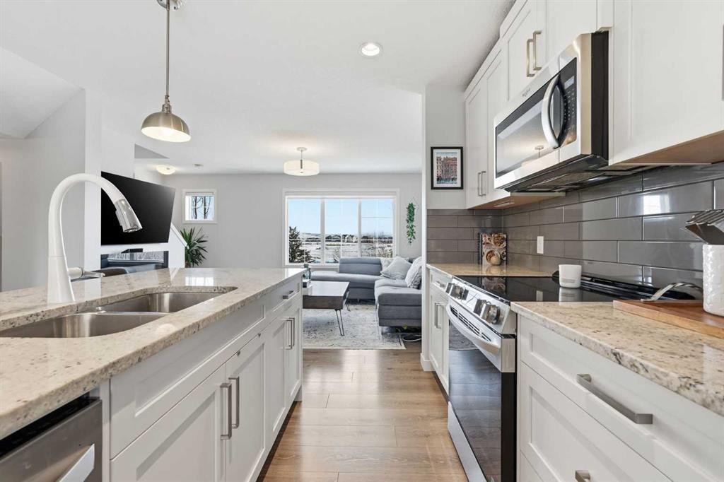2202-250 Fireside View, Cochrane, AB - Indoor Photo Showing Kitchen With Double Sink With Upgraded Kitchen