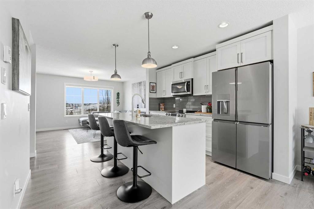 2202-250 Fireside View, Cochrane, AB - Indoor Photo Showing Kitchen With Upgraded Kitchen