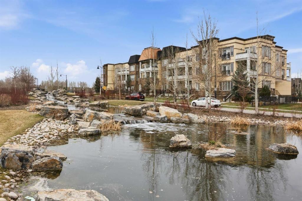 207-39 Quarry Gate Se, Calgary, AB - Outdoor With Body Of Water