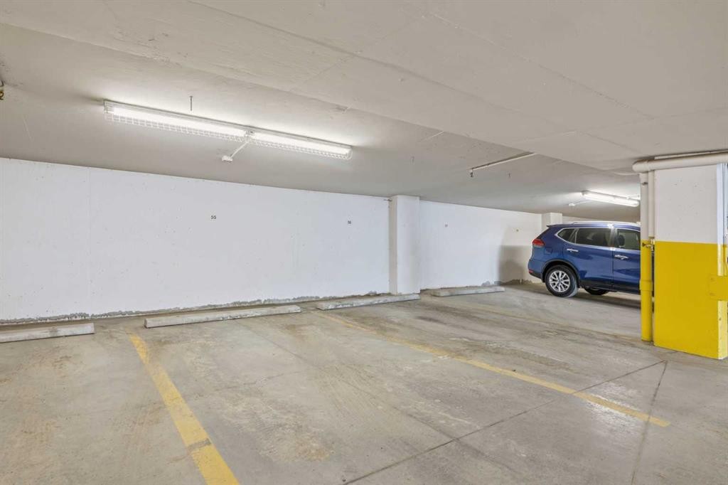 207-39 Quarry Gate Se, Calgary, AB - Indoor Photo Showing Garage