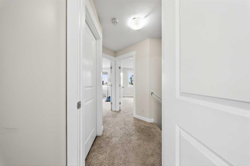 212 Cascades Pass, Chestermere, AB - Indoor Photo Showing Other Room