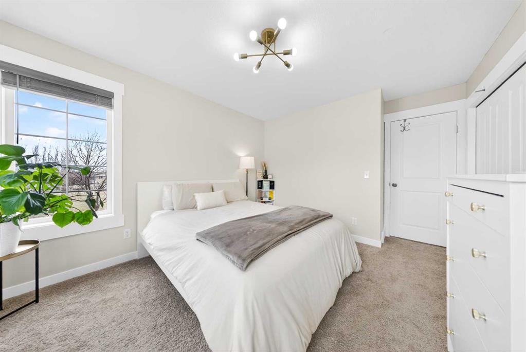 212 Cascades Pass, Chestermere, AB - Indoor Photo Showing Bedroom