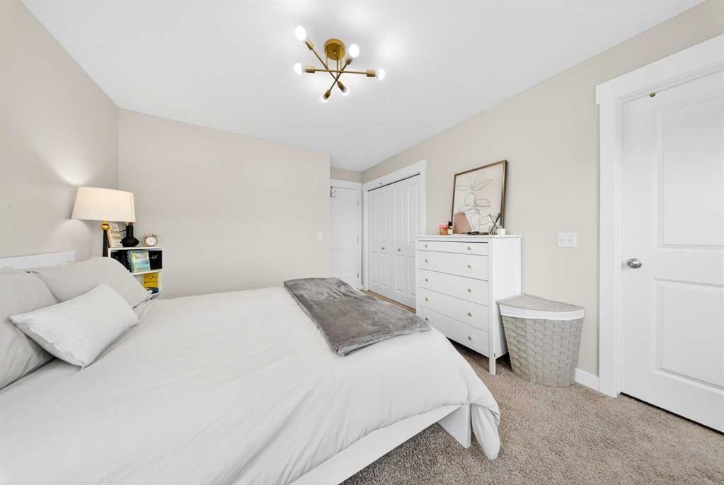 212 Cascades Pass, Chestermere, AB - Indoor Photo Showing Bedroom