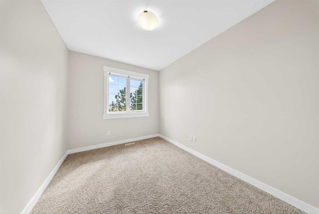 212 Cascades Pass, Chestermere, AB - Indoor Photo Showing Other Room