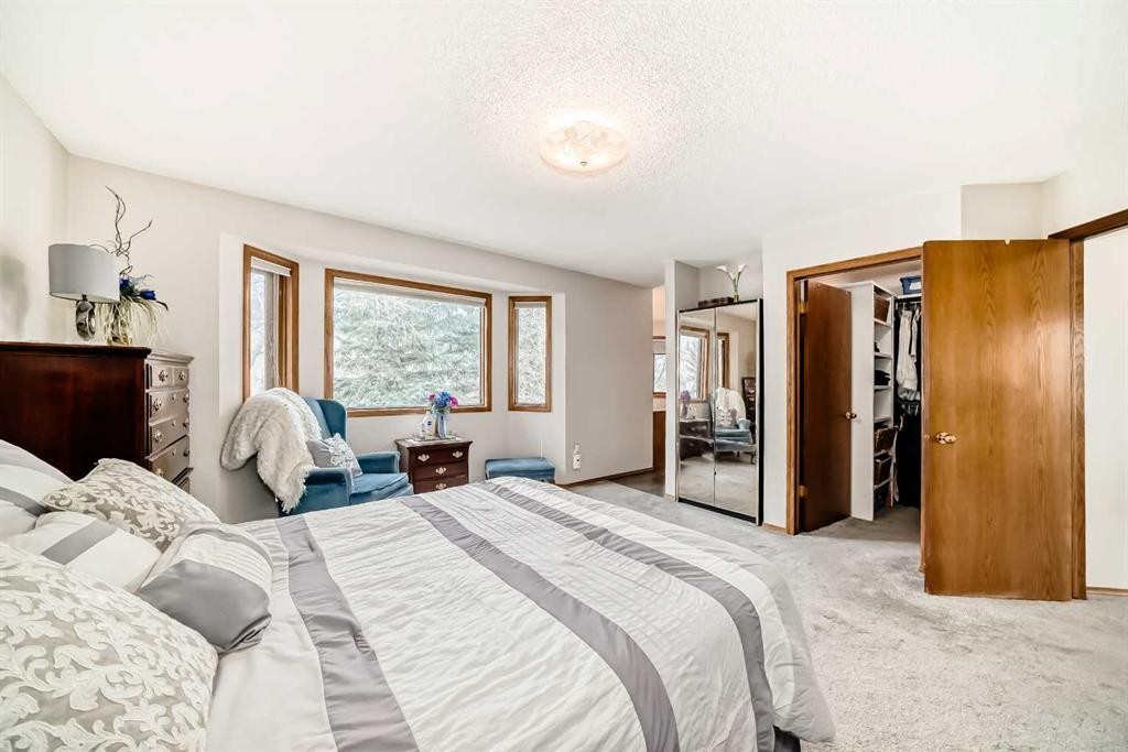 219 Hawkstone Close Nw, Calgary, AB - Indoor Photo Showing Living Room With Fireplace
