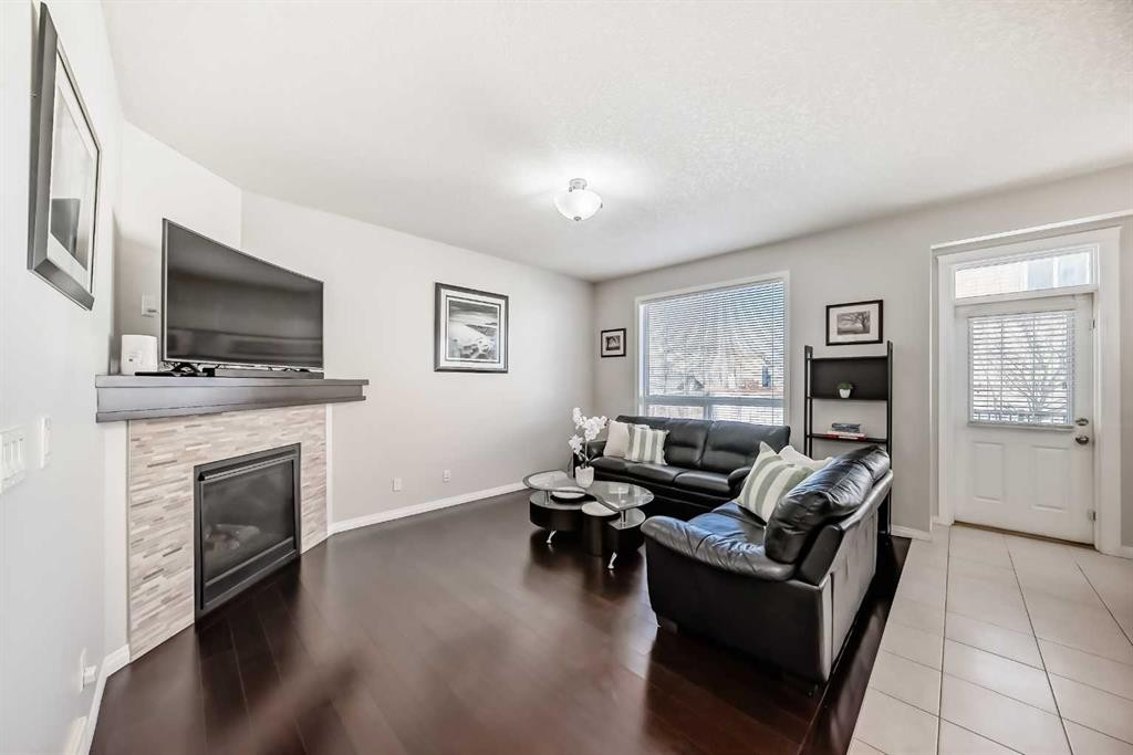 795 New Brighton Drive Se, Calgary, AB - Indoor Photo Showing Living Room With Fireplace