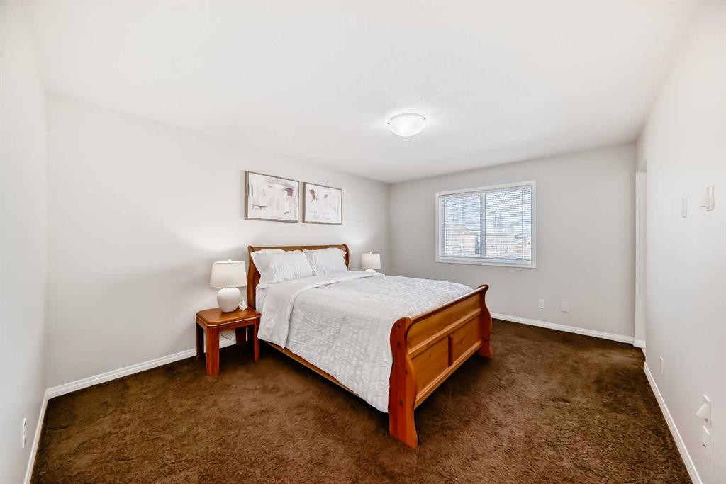 795 New Brighton Drive Se, Calgary, AB - Indoor Photo Showing Bedroom