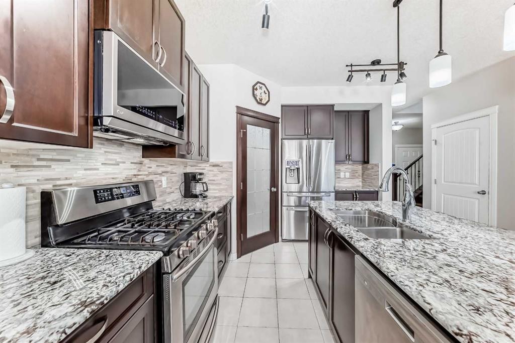 795 New Brighton Drive Se, Calgary, AB - Indoor Photo Showing Kitchen With Stainless Steel Kitchen With Double Sink With Upgraded Kitchen
