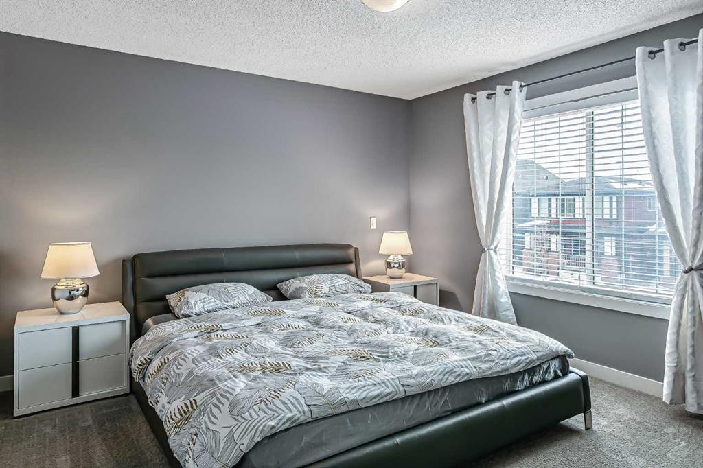 23 Marquis Link Se, Calgary, AB - Indoor Photo Showing Bedroom