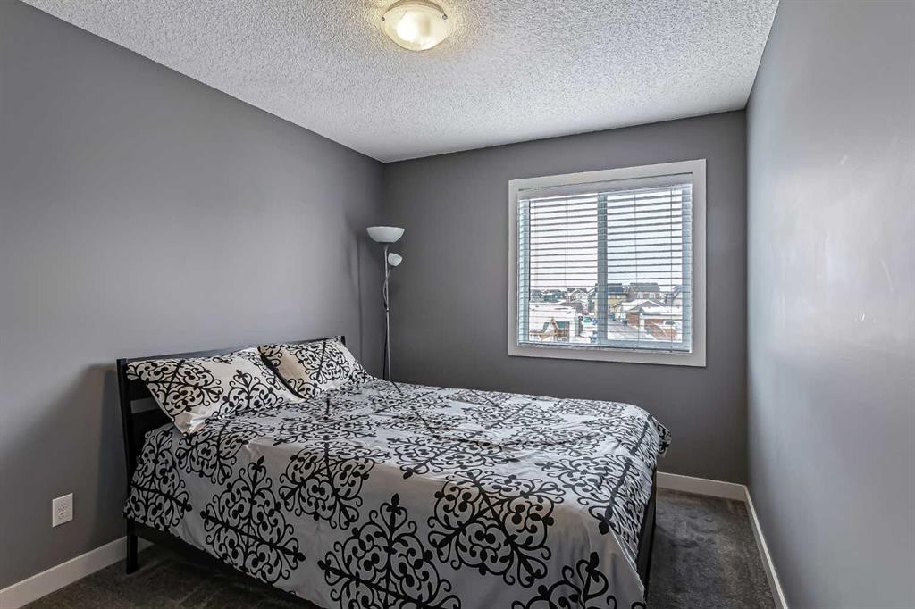 23 Marquis Link Se, Calgary, AB - Indoor Photo Showing Bedroom